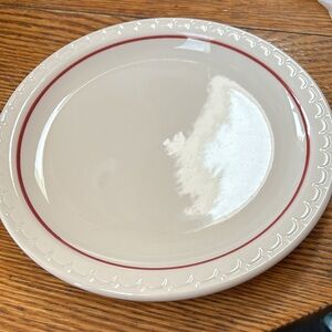 Syracuse China Company restaurant plate.  Cream with red line on edge.